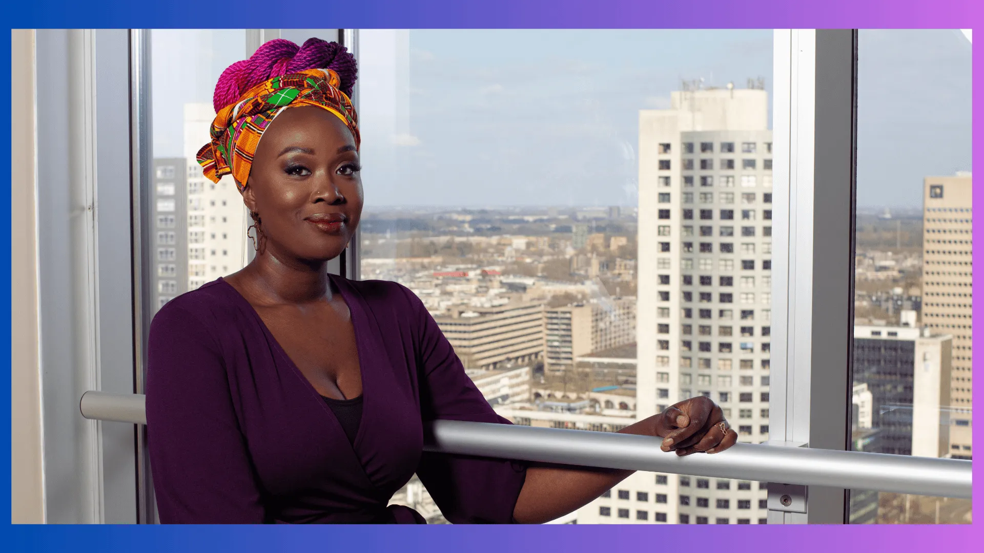 woman in a purple dress with colorful headwrap against city skyline
