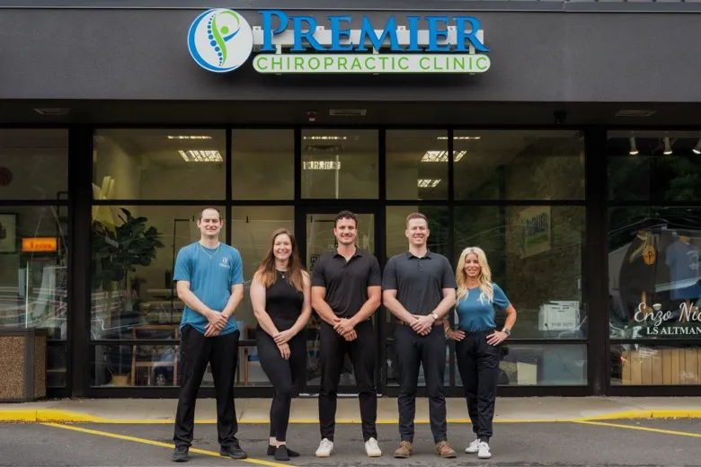 The Premier Chiropractic Clinic team in front of the office