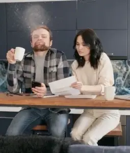 Man reacts in shock as tax adviser points out an error