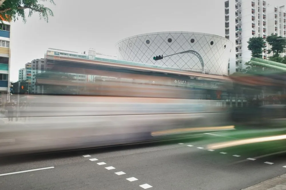 Commuters boarding a public bus in Singapore amid fare increase announcement