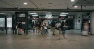Commuters inside a Singapore MRT train carriage on a busy weekday morning