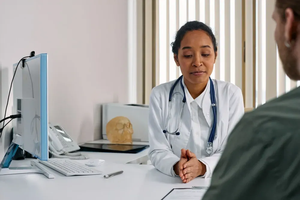 Botox for Chronic Migraines in Plano, TX | Same-Week Consults 2 Interventional pain specialist reviewing migraine history with a patient before Botox procedure