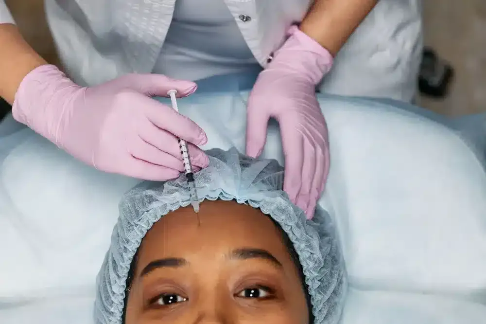Botox for Chronic Migraines in Plano, TX | Same-Week Consults 3 Close-up of precise Botox injection administered along forehead for chronic migraine management