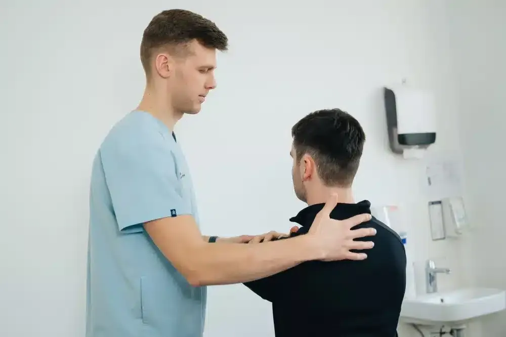 Shoulder Injection in Tyler, TX | Non-Surgical Relief Options 3 Patient doing guided shoulder physical therapy exercises after a pain injection