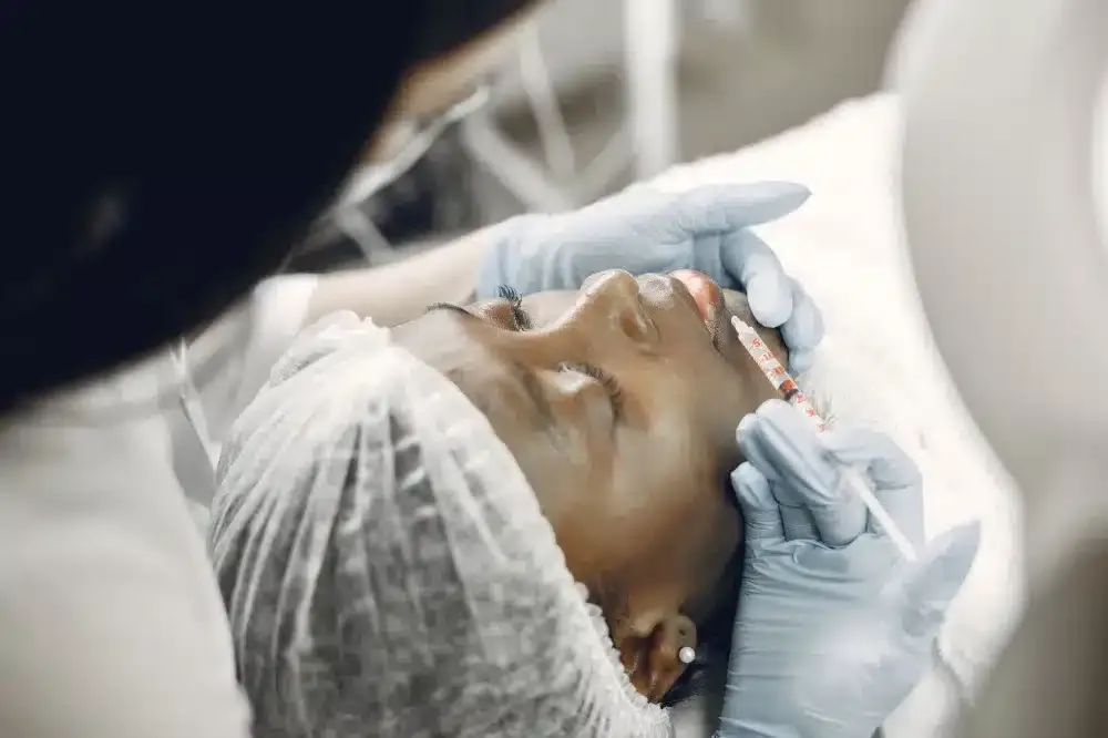 Botox for Chronic Migraines in Grand Prairie, TX | Same-Week Consults 2 Clinician administering targeted injection to neck area for migraine pain management