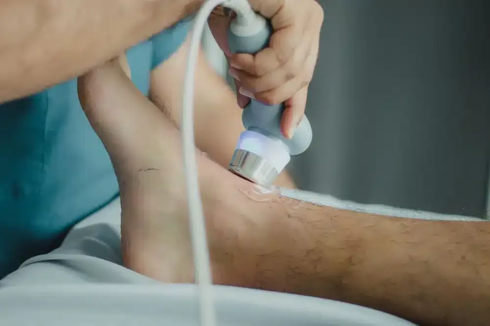 Hip Joint Injection in Plano, TX | Non-Surgical Relief 2 Clinician performing an ultrasound-guided hip injection on a patient in a procedure room