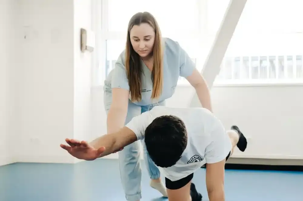 Hip Joint Injection in Plano, TX | Non-Surgical Relief 3 Patient doing gentle hip stretching exercises during physical therapy rehabilitation