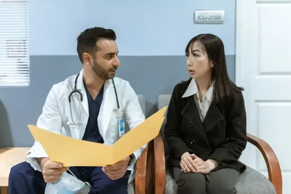 Hip Joint Injection in Plano, TX | Non-Surgical Relief 4 Doctor reviewing treatment plan with a hip pain patient during a follow-up visit