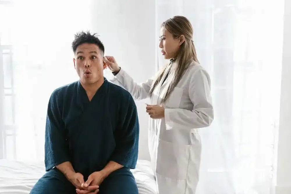 Lumbar Epidural Steroid Injection in Longview, TX | Non-Surgical Options 3 Pain management doctor reviewing lumbar MRI scan with patient before epidural steroid injection