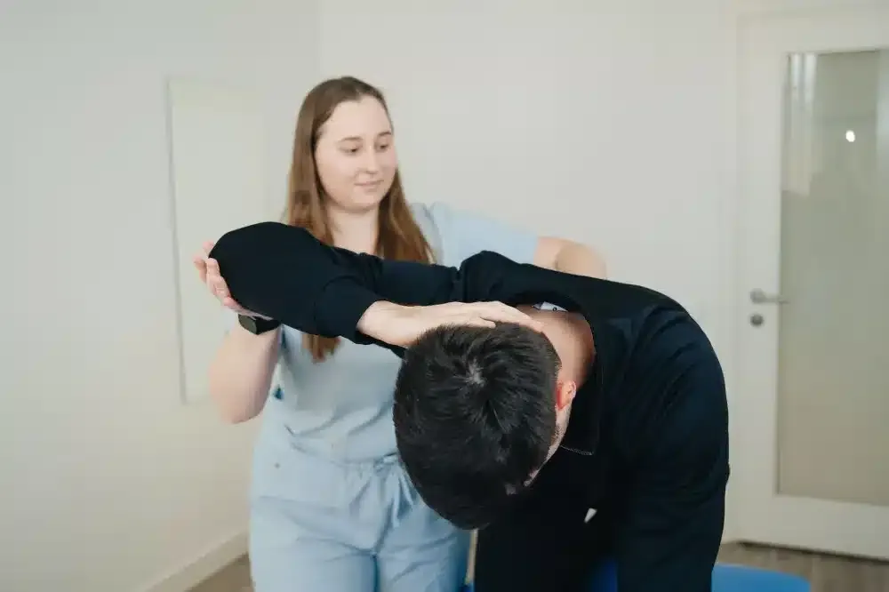 Lumbar Epidural Steroid Injection in Longview, TX | Non-Surgical Options 4 Patient doing physical therapy back exercises as part of herniated disc recovery plan