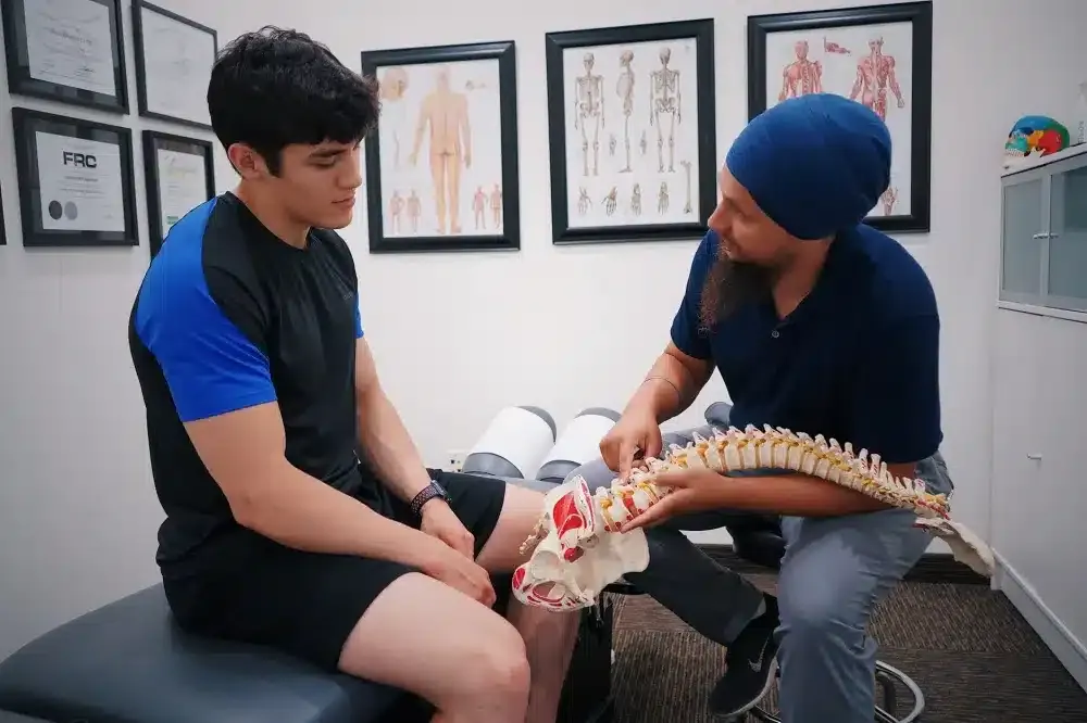 Physical Therapy for the Spine in Grand Prairie, TX | Non-Surgical Care 1 Pain management doctor consulting a patient about back pain treatment options in Texas