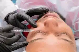 Physician preparing a PRP injection for tendon injury treatment in Tyler TX