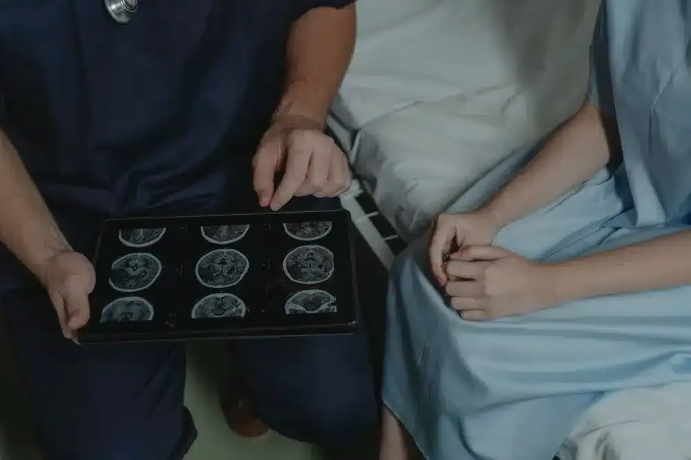 Radiofrequency Ablation in Grand Prairie, TX | Non-Surgical Relief 4 Interventional pain specialist reviewing lumbar MRI scans to plan a radiofrequency ablation treatment