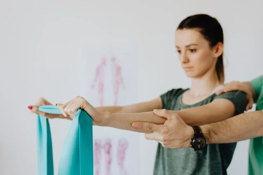 Trigger Point Injections in Plano, TX | Same-Week Consults 4 Physical therapist guiding patient through therapeutic stretching exercises for muscle pain relief