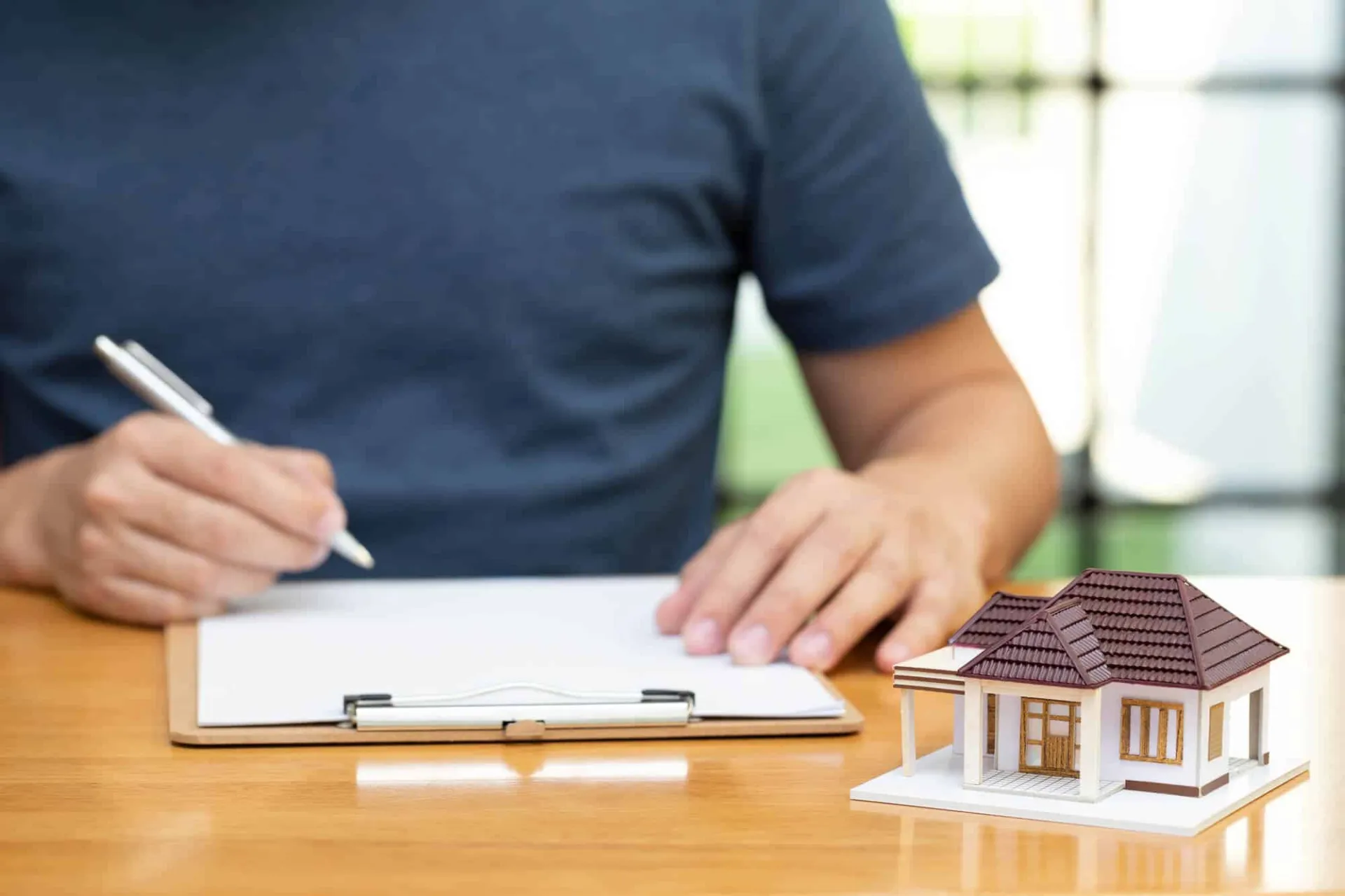 man filling up refinancing form