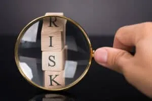 Inspecting risk blocks with loupe over black background