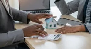 Indian businessman is having a discussion with an African American real estate agent