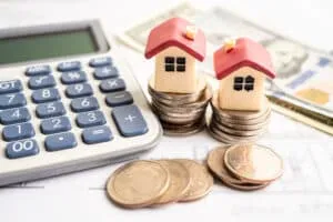 House model with stack of coin money, home loan, saving plan, in