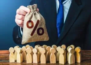 A businessman offers a bag with percent symbol to people. Favorable investment offer. Deposit. Loan interest rate. Collection of taxes. Dividend payment. Financial support. Retirement savings.