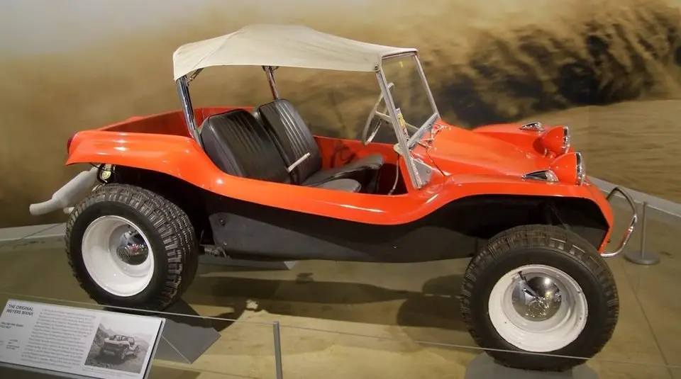 Wheel and suspension area with the tire removed, where the ball joints connect the control arm to the steering knuckle