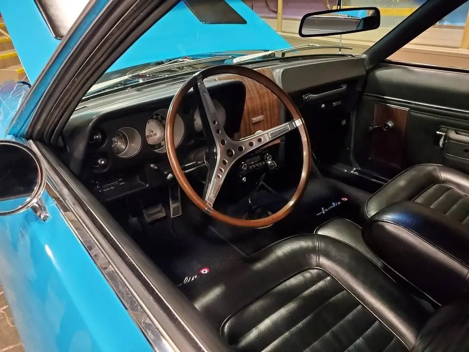 Car interior with side windows and dashboard, showing the glass that may need replacement after a break-in