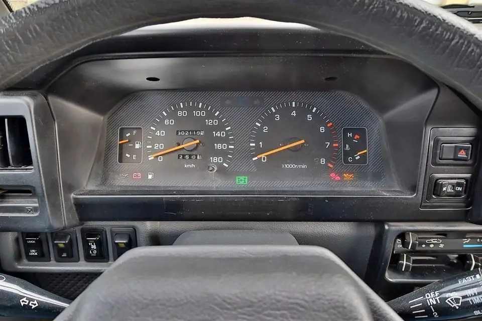 Instrument cluster with warning lights, where a flashing check engine light signals a severe misfire