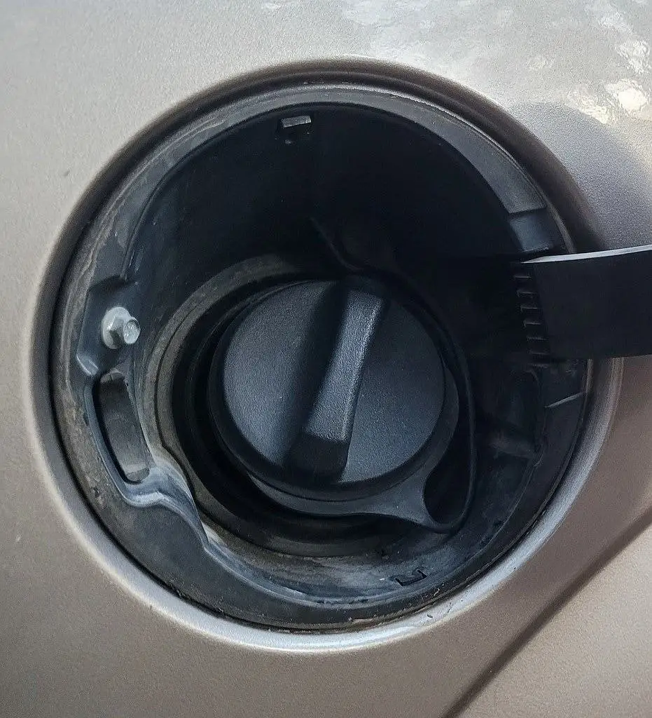 Open fuel door showing the gas cap, a common cause of EVAP check engine codes