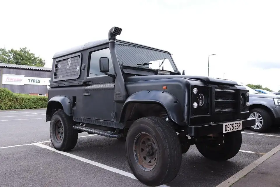 Diesel off-road vehicle in a parking lot; most modern diesels use a diesel particulate filter