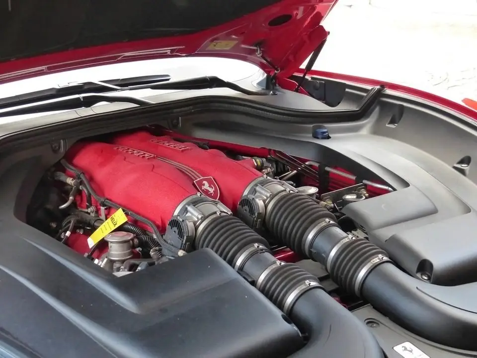 Open engine bay of a car, where motor mounts hold the engine to the frame