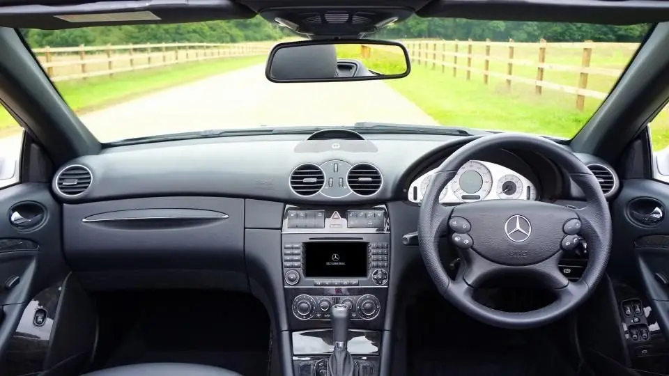 Driver view of a car steering wheel, which turns the rack and pinion that steers the front wheels