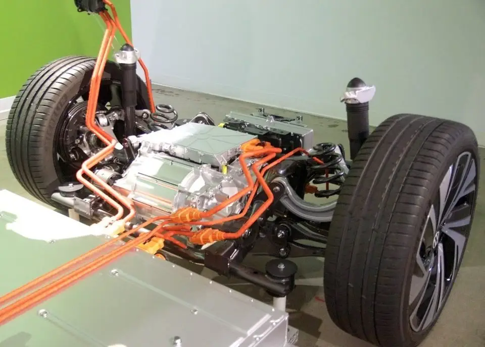Exposed car chassis showing the front steering and suspension where the tie rods connect the wheels