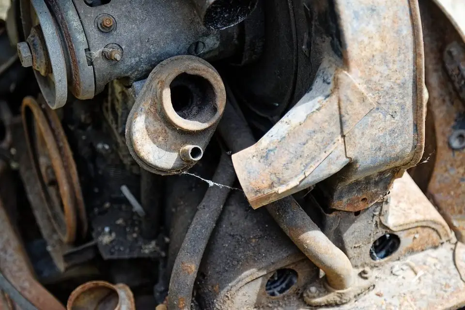 Close-up of an older engine front, where the timing belt and pulleys sit behind covers