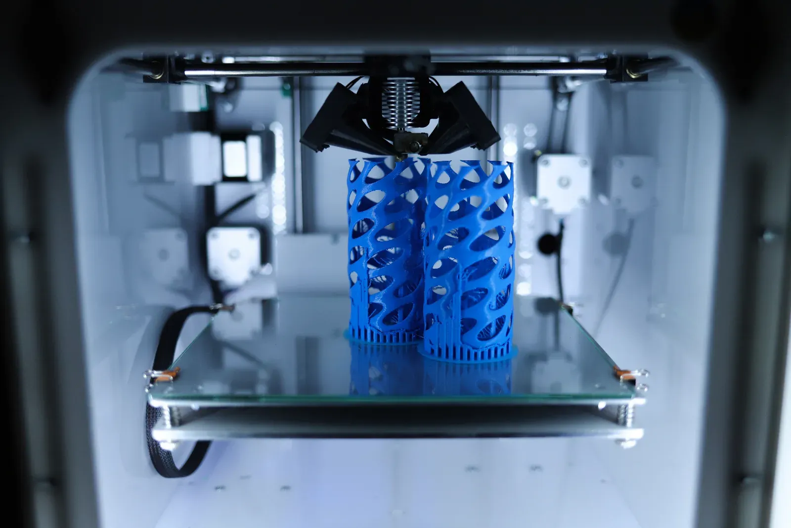 Close up of a 3D printer producing a plastic prototype model for advertising and display use