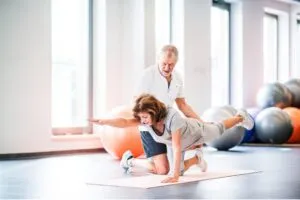 lady exercising with trainer