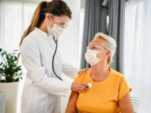 lady having her heart beat checked