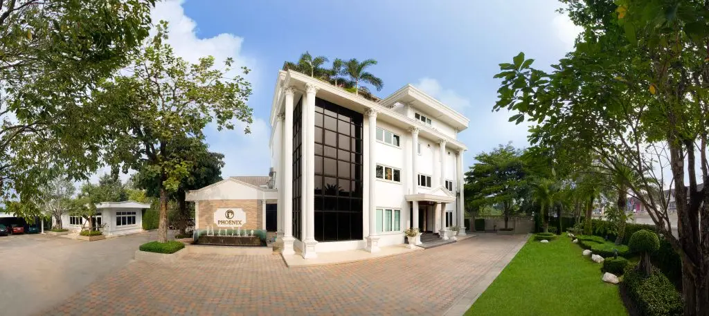 Phoenix Metal - Phoenix Electroforming - Wealth Jewelry - Modern jewelry store building with large glass windows and lush landscaping.