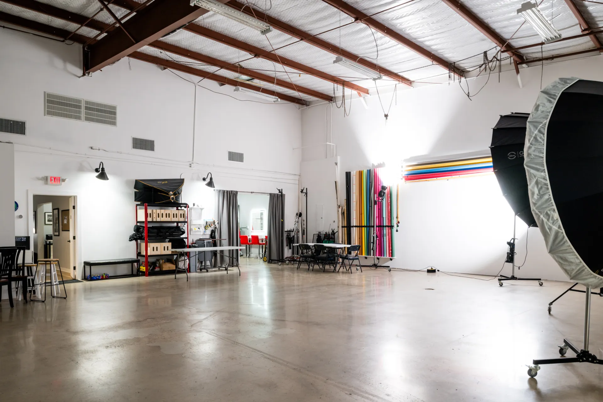 Commercail photography studio B showing the overall space with seamless paper holder and entrance into makerup area