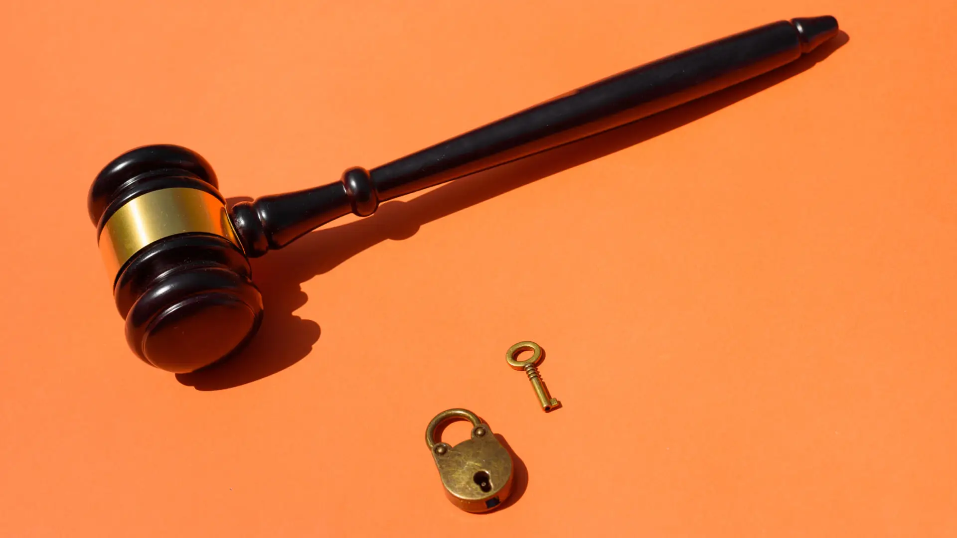 Judge gavel with lock and key representing legal protection and access rights