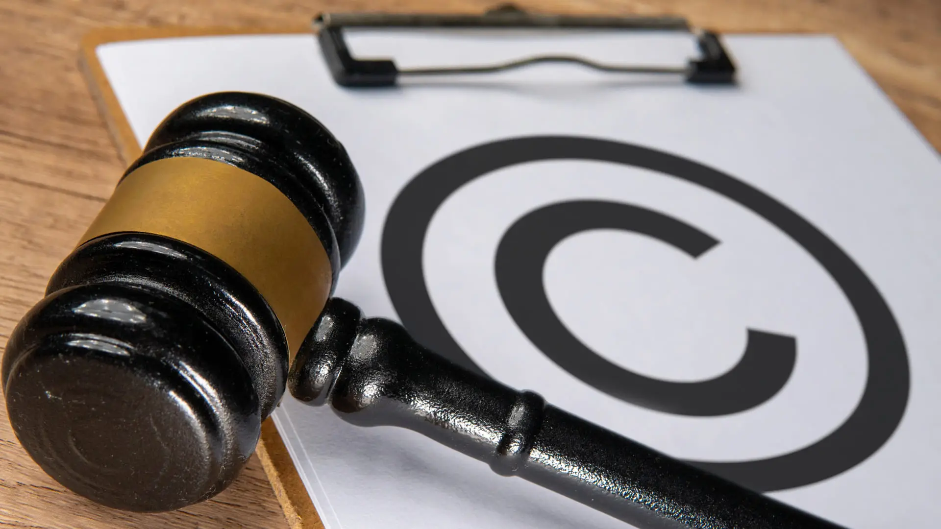 Judge’s gavel beside a copyright symbol.