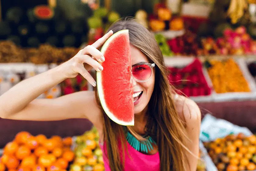 closeup-portrait-funny-girl-pink-sunglasses-holding-slice-watermelon-half-face-tropical-fruits-market-Superfoods With Low Calories Why We Love Superfood (And You Should, Too)