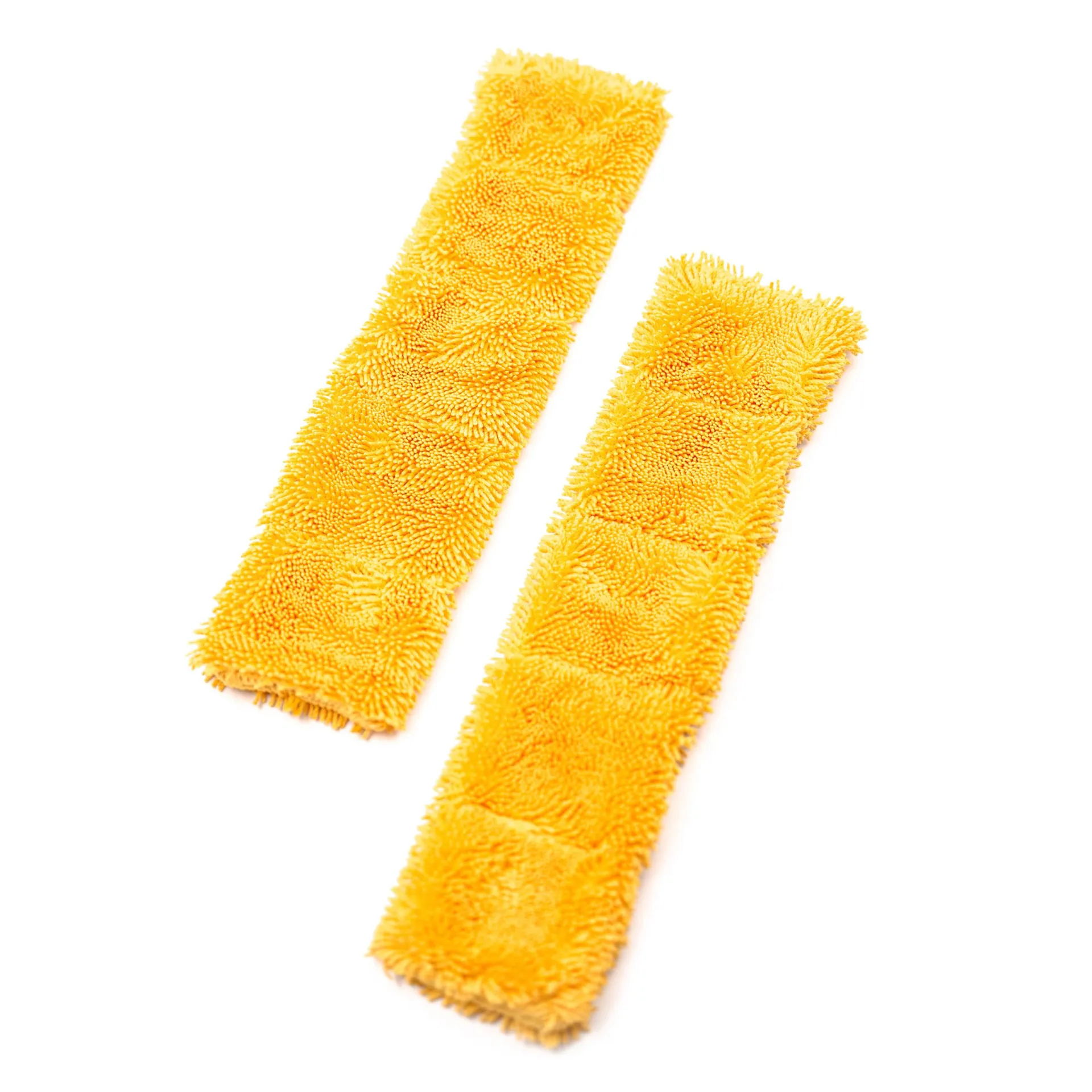 Two yellow rectangular microfiber pads with shaggy texture are placed diagonally on a white background.
