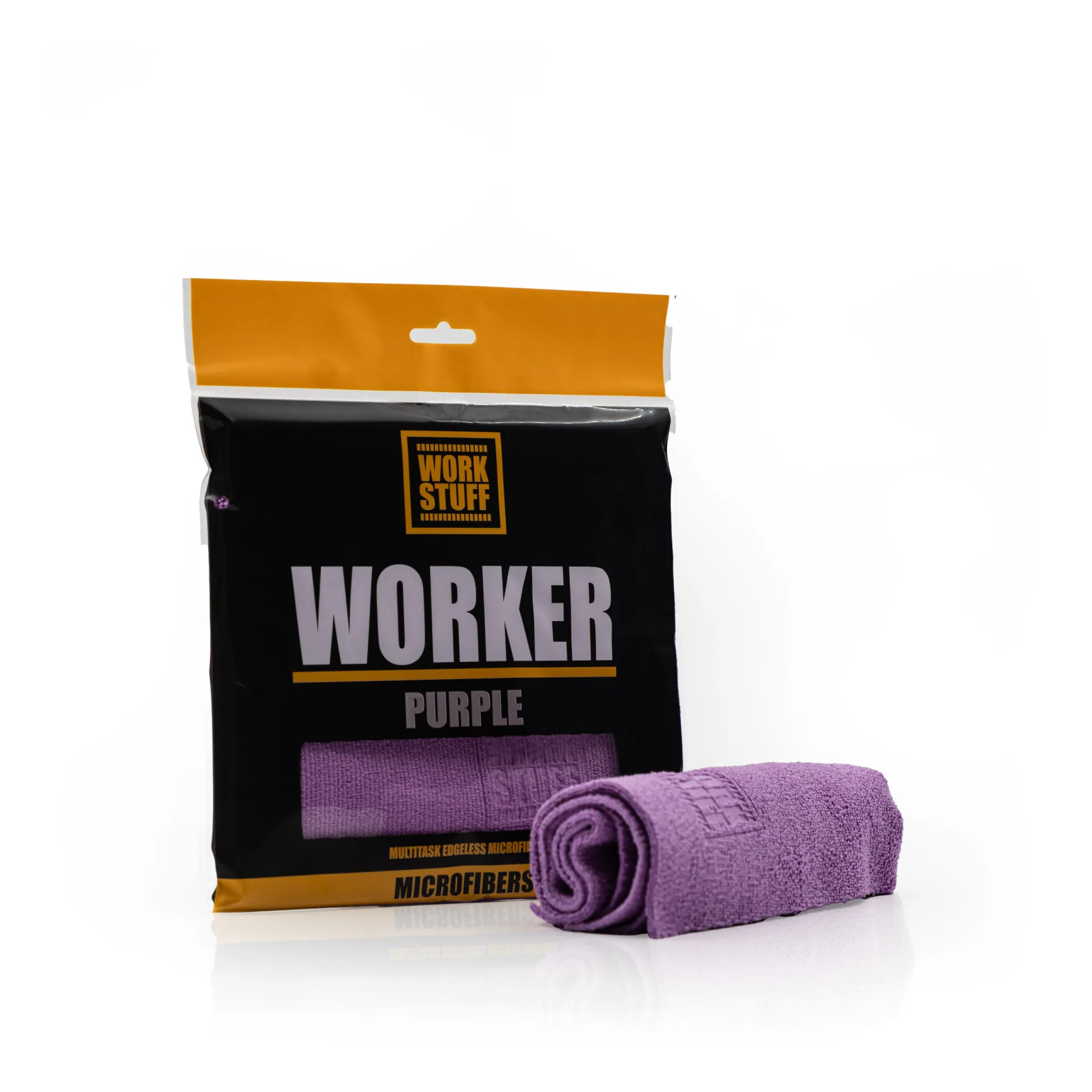 Un paquete de paños de microfibra púrpura con la etiqueta WORKER PURPLE de Work Stuff está en posición vertical con un paño a juego desenrollado delante.