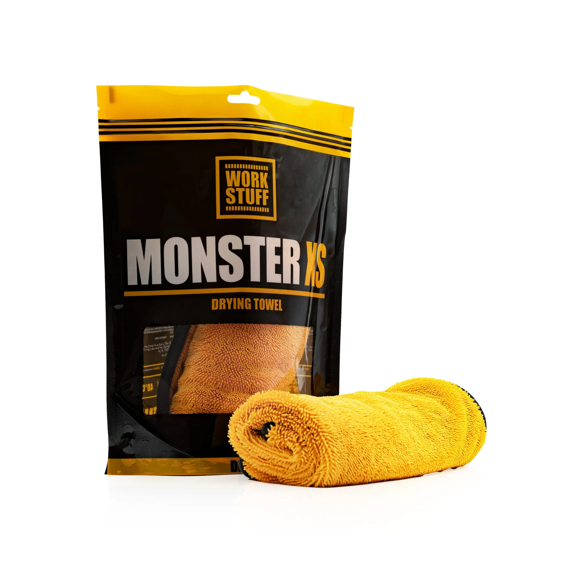Yellow Work Stuff MONSTER XS drying towel, twisted pile fiber, partly unrolled before black and yellow packaging on white.