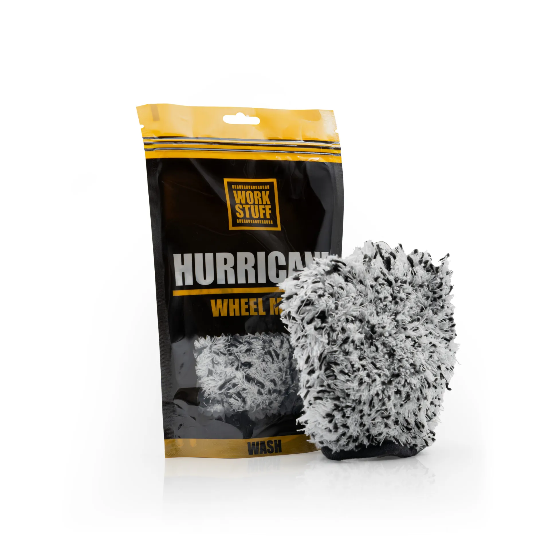 A black and yellow package labeled Work Stuff HURRICANE Wheel Mitt stands upright beside a fluffy black and white wash mitt.