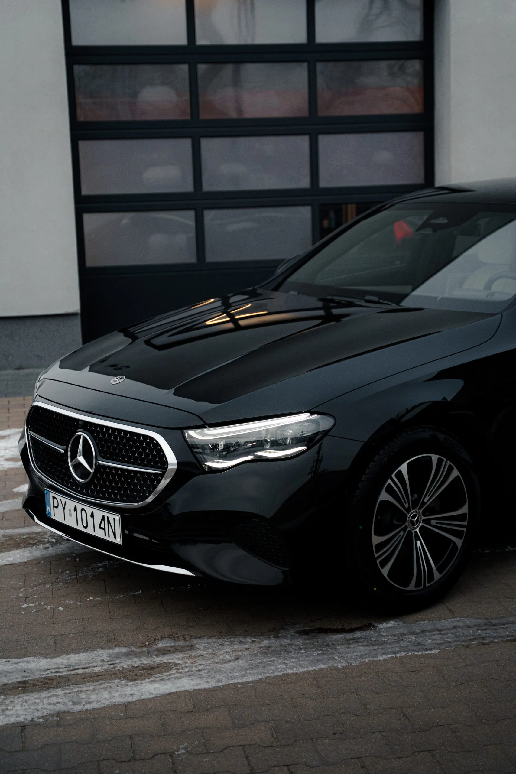 Glossy black car finish after graphene ceramic coating application