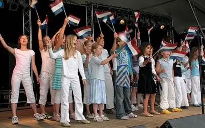 Flag Day is also known as Vlaggetjesdag Scheveningen, a fun (and free!) festival that takes place in the Dutch harbor of Scheveningen. Flag Day happens every year in June and was originally the day when fishing boats in the harbor were decorated before setting sail to catch herring. Even though the Dutch use more modern forms of fishing practices now, Flag Day is still a popular festival that residents love and that draws in tourists who are visiting the area. Lots of fun activities happen constantly Flag Day, especially ones that kids will enjoy. Children love watching the puppet show put on by the residents and playing traditional Dutch children's games like marbles rolling, jumping rope, rolling barrels, walking in traditional clogs - all with prizes or yummy Dutch sweets. Residents wear traditional Dutch customers and ook put on demonstrations of the different trades or Scheveningen in action. The entire family will enjoy the Tattoo, the musical aspect of Flag Day. More than 200 musicians from all over the country descend upon Scheveningen to put on energetic shows and performances. Some of the more popular musicians include the ex... Of course, Flag Day would not be complete without a tasting session or enjoying herring the mustaches on display at the mustache competition. Entry to completely Flag Day is free, as are the fun contests and activities That festival goers are welcome to take part in. The easiest way to get to Scheveningen via public transportation, All which is what the organizers of Scheveningen recommend. It is ook easy to get there by bicycle, moped or car, Although rates apply to park your vehicle of choice. Please visit Scheveningen online to find more information about practical for the festival, along with the dates for June 2016. Flag Day Scheveningen