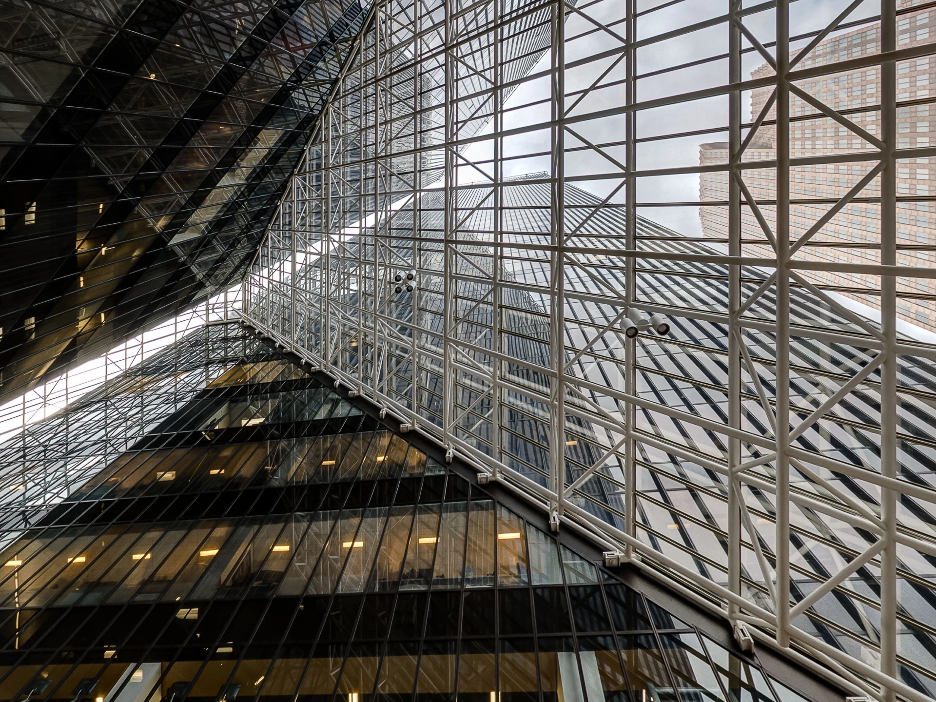 Looking up through the geometric glass facade of Pennzoil Place, Houston architectural photography by Dee Zunker