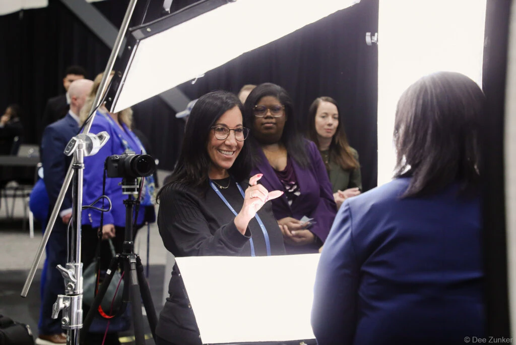 Expression coaching at headshot station at george R Brown Convention Center in downtown Housotn, TX