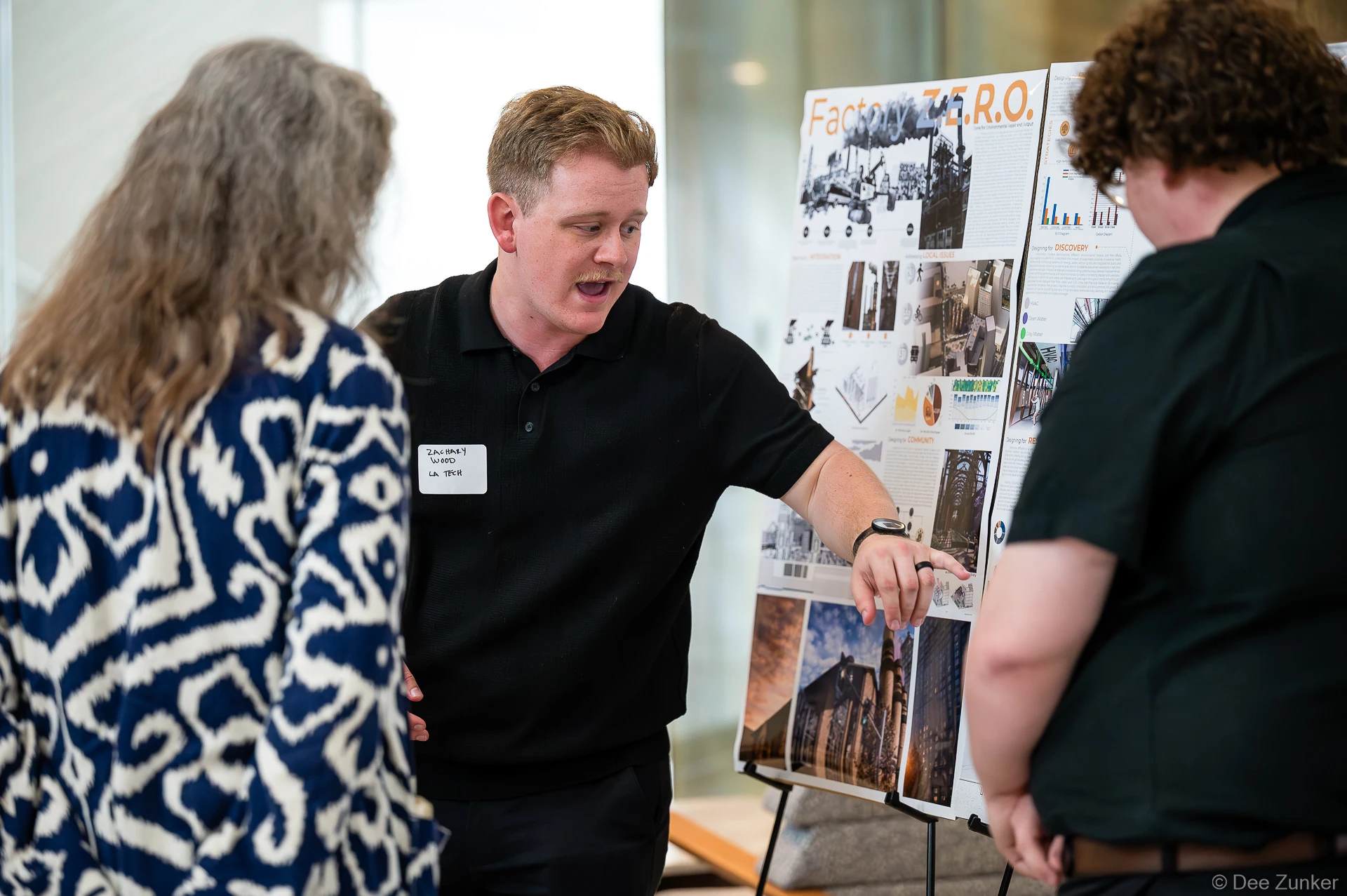 Student Zachary Wood from LA Tech presents his Factory Z.E.R.O. design board to attendees at Gulf Coast Green 2026, Ismaili Center Houston.