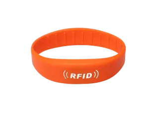 РФИД опсег во портокал, featuring the text "RFID" во бело, е еден од нашите разноврсни РФИД опсези дизајнирани да задоволат различни потреби за безбедност и идентификација.